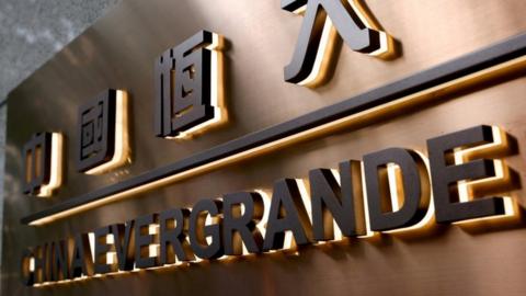 Evergrande: Crisis-hit property giant faces deadline after bosses quit