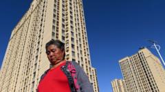 China cuts lending rates as property market struggles