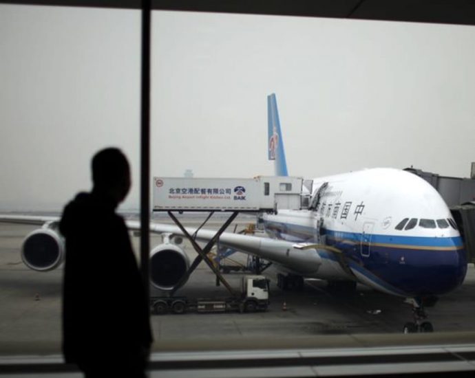 China shortens suspensions for international flights linked to COVID-19 cases