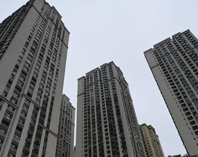 In two Chinese cities, civil servants told to help offload unsold homes