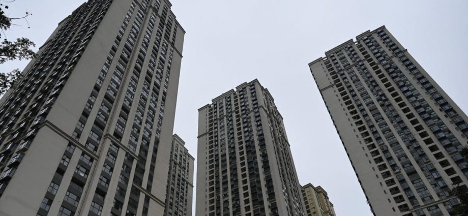 In two Chinese cities, civil servants told to help offload unsold homes