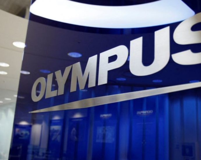 Japan’s Olympus to sell microscope unit to Bain for US billion