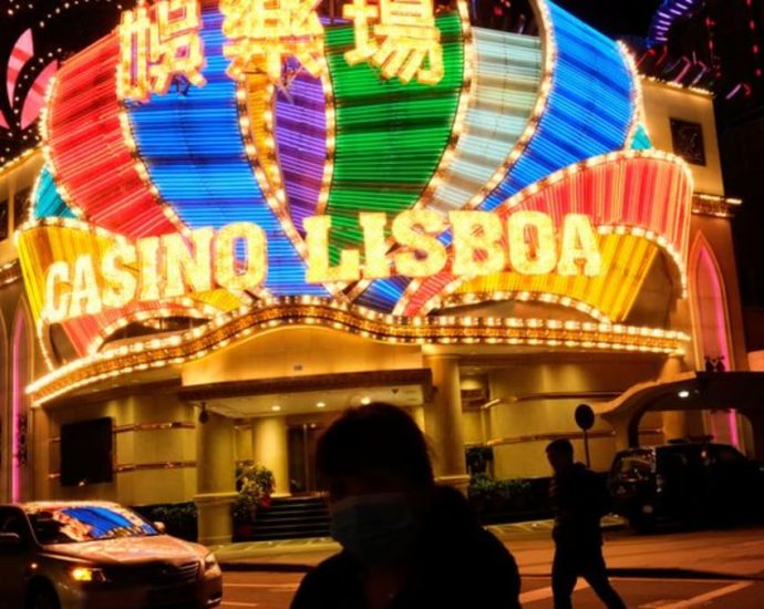 Macao sets first formal cap on casino tables, income amid bidding war