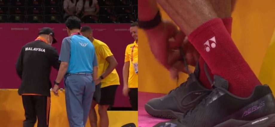 Malaysia's badminton coach Hendrawan lends shoes to rival player during match at 2022 Commonwealth Games