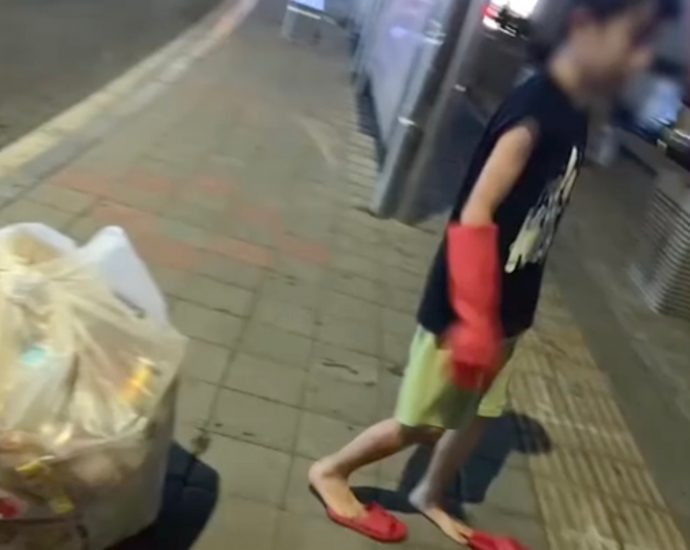 Mother in China triggers tough parenting debate after making son, 8, collect rubbish to repay US he stole from grandmother