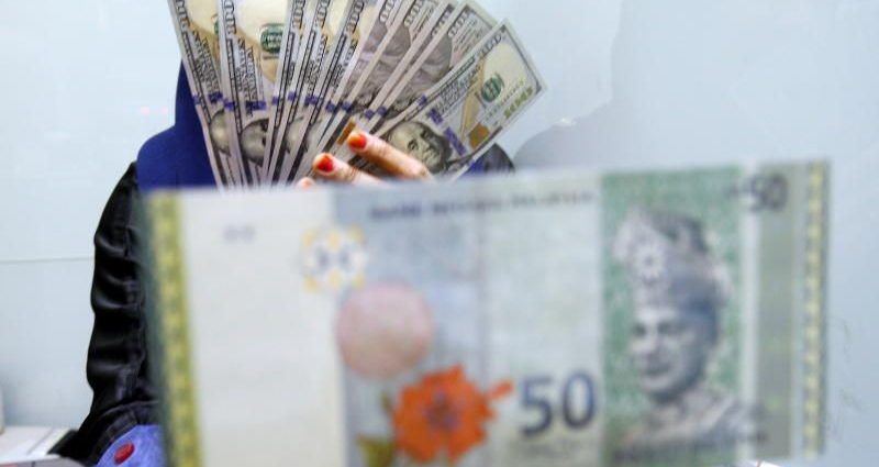 Ringgit eases further as risk-off mode remains after Fed’s minutes