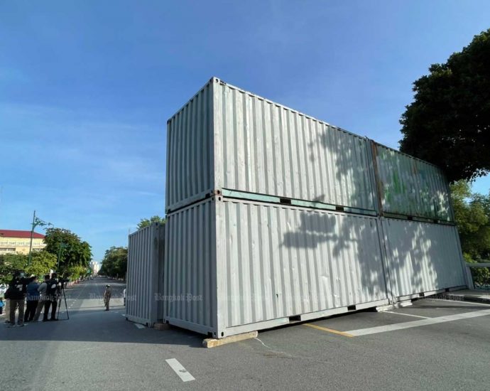 Shipping containers block approach to Government House