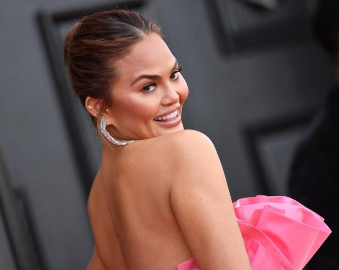 Chrissy Teigen says she can finally feel her baby