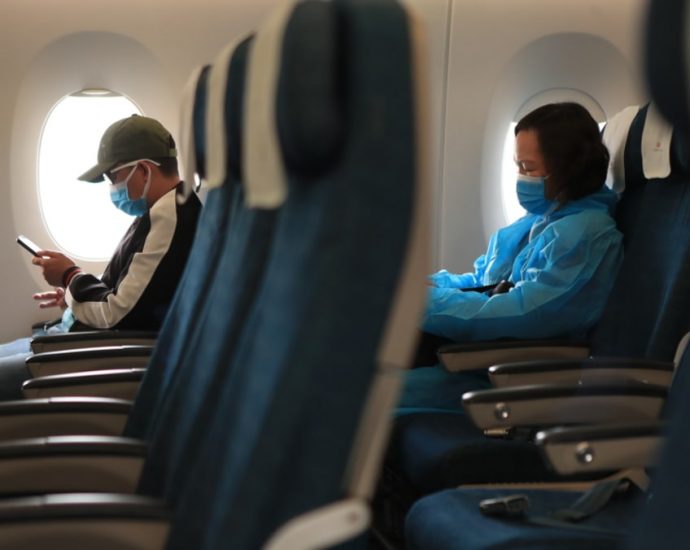 Commentary: No need to be too anxious about flying without a mask