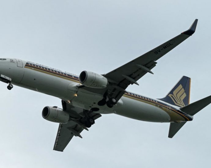 Man charged for causing alarm after allegedly making bomb threat on Singapore Airlines flight SQ33