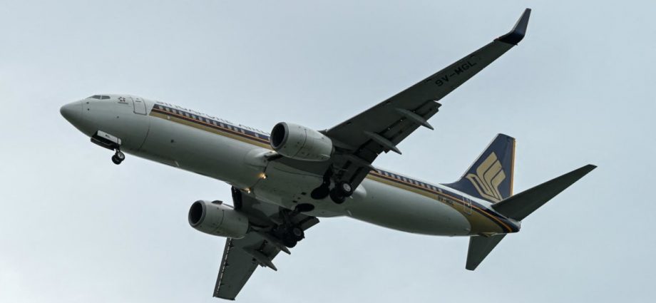 Man charged for causing alarm after allegedly making bomb threat on Singapore Airlines flight SQ33