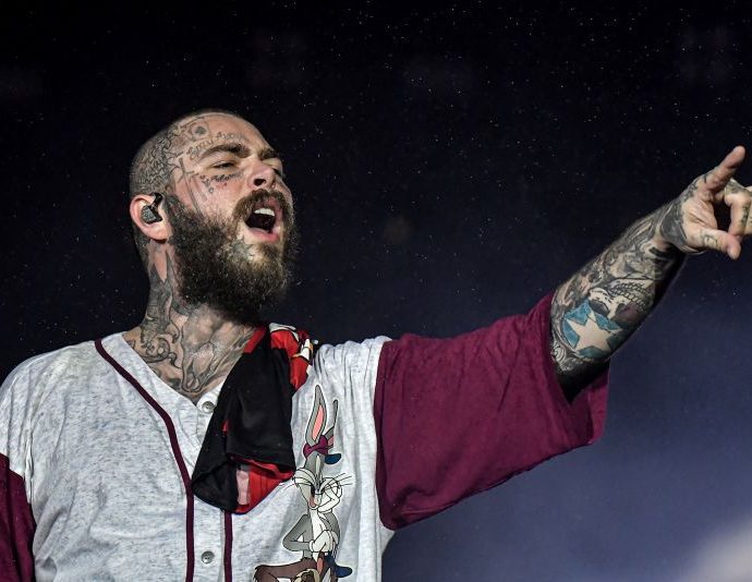 Post Malone suffers bruised ribs after falling through a hole on stage in St. Louis