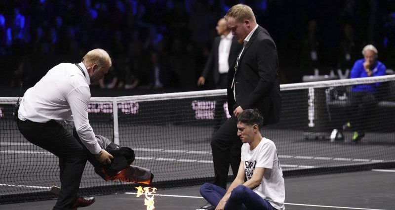 Protester sets arm on fire during Laver Cup tennis match ahead of Federer's farewell