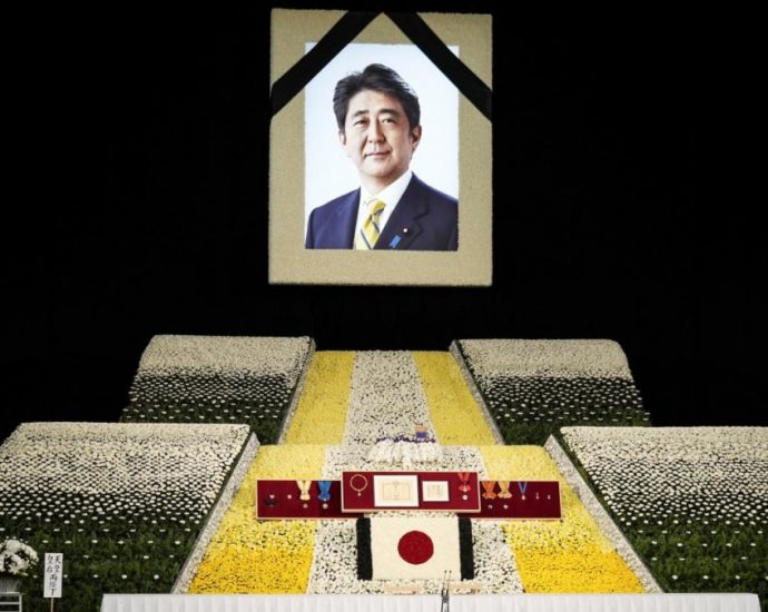 With flowers and a gun salute, Japan bids farewell to slain Abe at state funeral