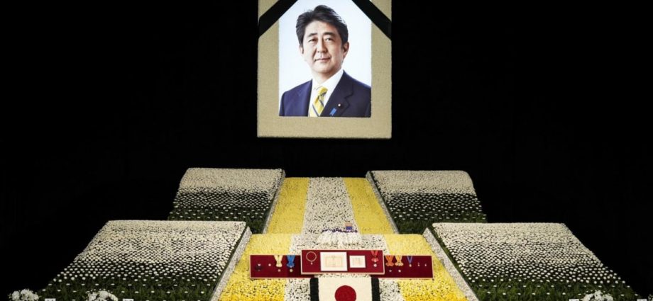 With flowers and a gun salute, Japan bids farewell to slain Abe at state funeral