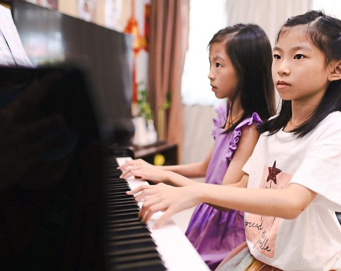 7YO twins from Puchong pass piano Grade 8, enter Malaysia Book Of Records