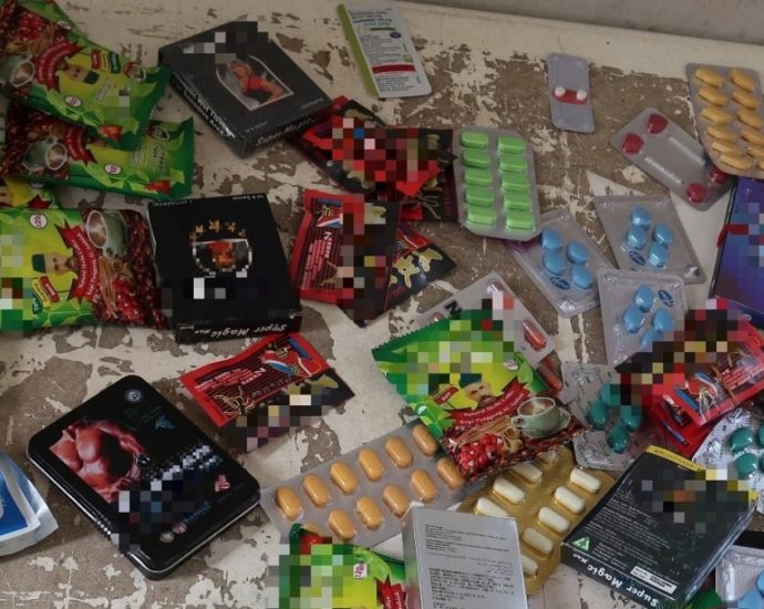 Cough syrup, sexual enhancement products seized in Geylang raids against illegal activities