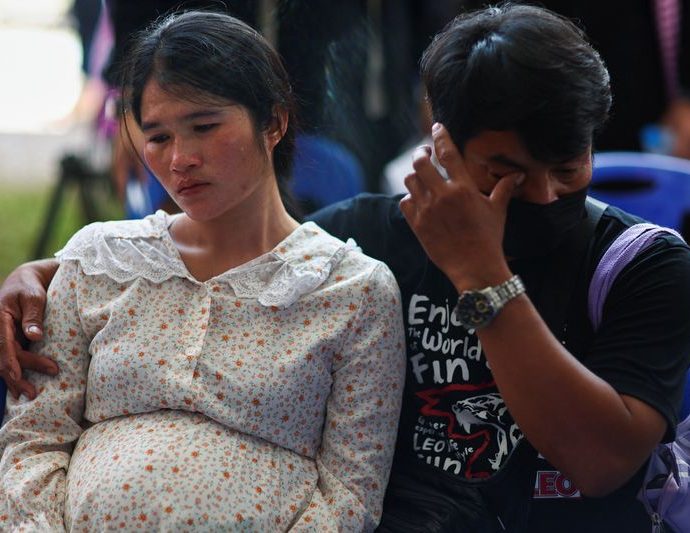 Day after Thai attack, traumatised relatives cling to slain childrens' toys