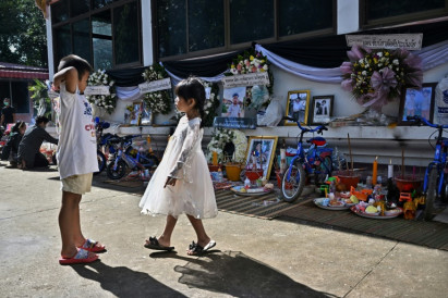 Families gather for mass cremation of nursery massacre victims