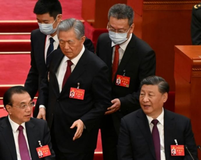 Former China president Hu Jintao unexpectedly leaves Congress closing ceremony