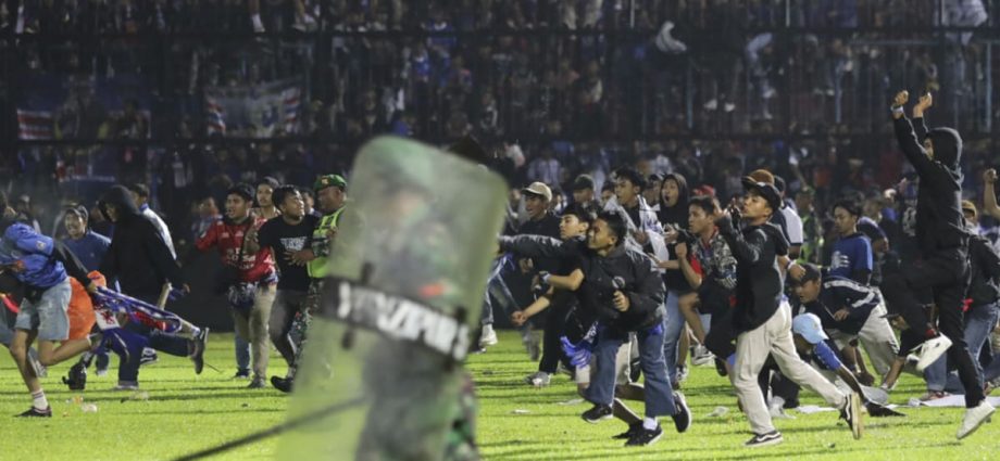Indonesia police say 129 people killed after stampede at football match