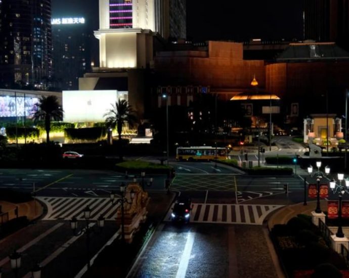 Macao reimposes COVID-19 curbs with casino lockdown as infections creep up