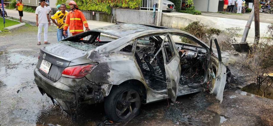 Swedish driver helped out of burning car