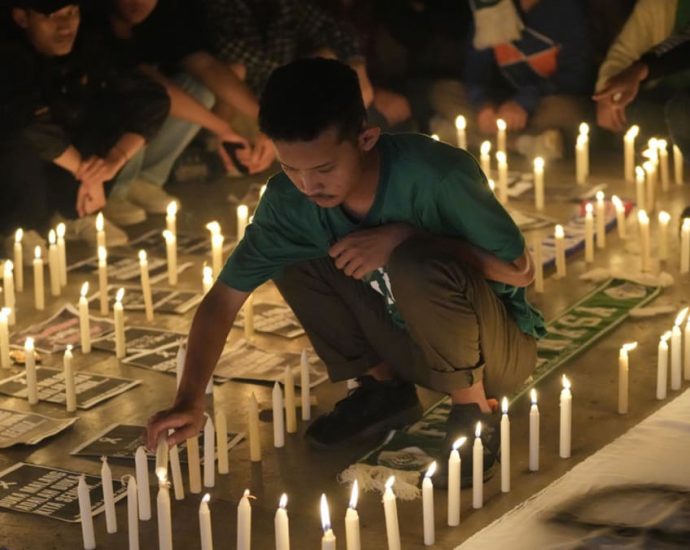 ‘Time to reflect’: Indonesia’s football fans set aside rivalry in wake of deadly stadium stampede