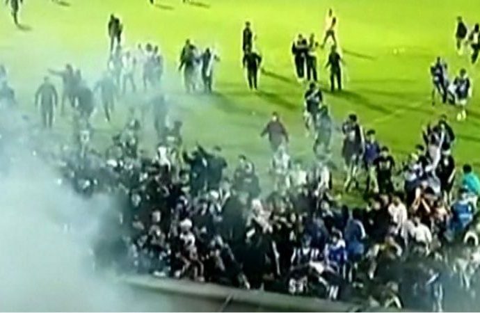 Tear gas fired by Indonesia police blamed for deadly football match crush, report says