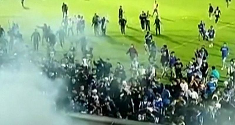 Tear gas fired by Indonesia police blamed for deadly football match crush, report says