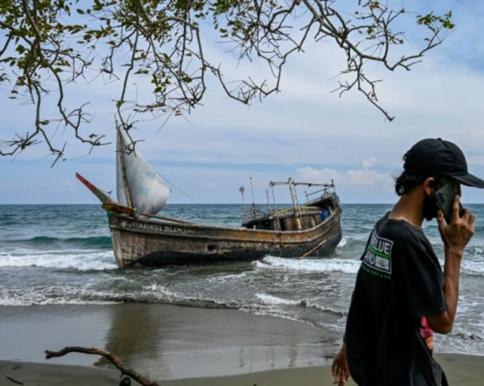 Rohingya refugee boat lands in Indonesia after a month at sea