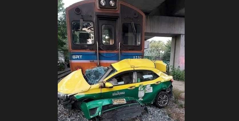Taxi hit by train at crossing, cabbie killed