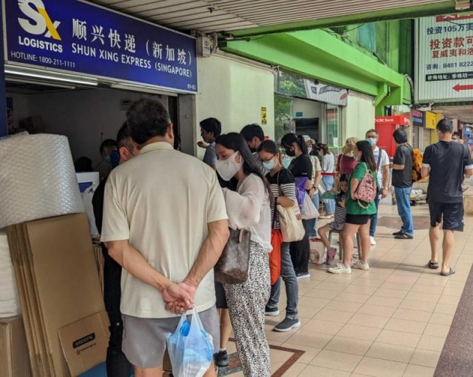 Worried China nationals in Singapore queue to send Panadol to relatives back home