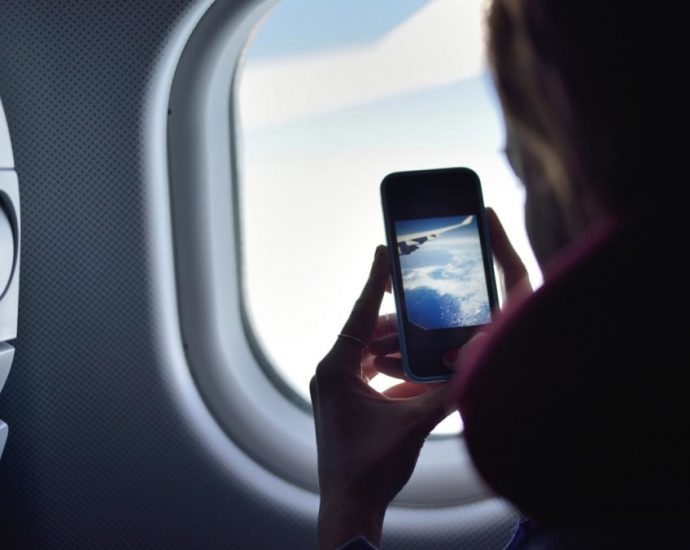 CNA Explains: Should you switch off your phone while on a flight?