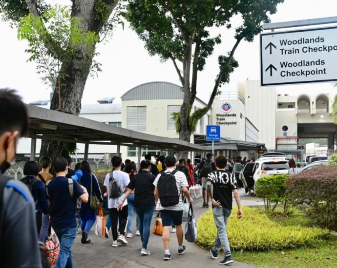 Crowds descend on Woodlands Checkpoint as people cross Causeway to celebrate Chinese New Year