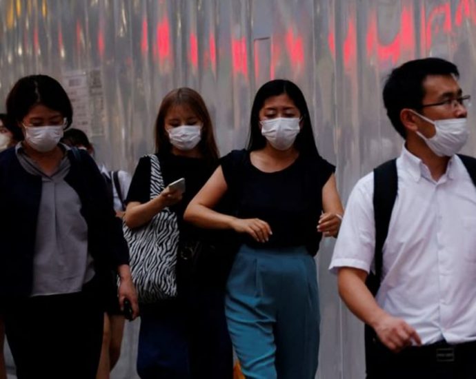 Japan to consider downgrading COVID-19 to same category as seasonal flu