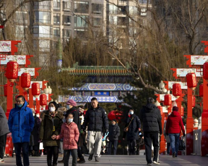 People in China pray for health during Chinese New Year as COVID-19 death toll rises