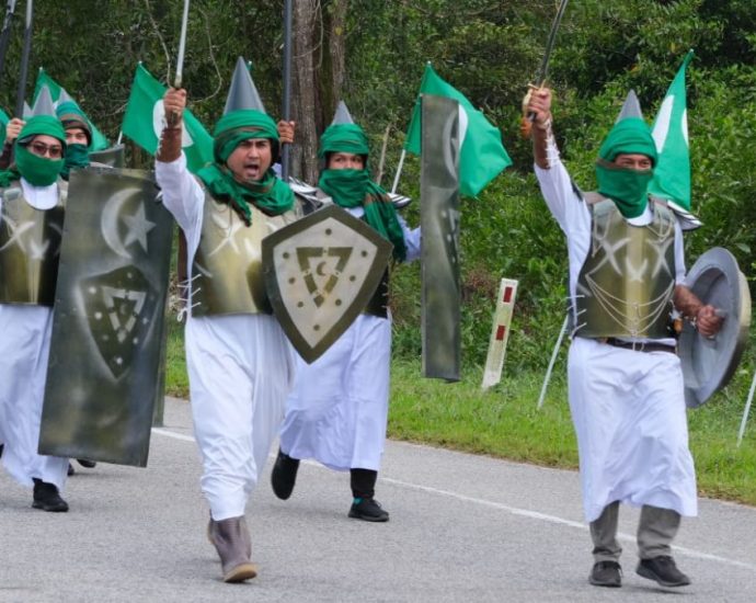 Islamic party in Malaysia under probe after members stage march with fake swords, spears and shields