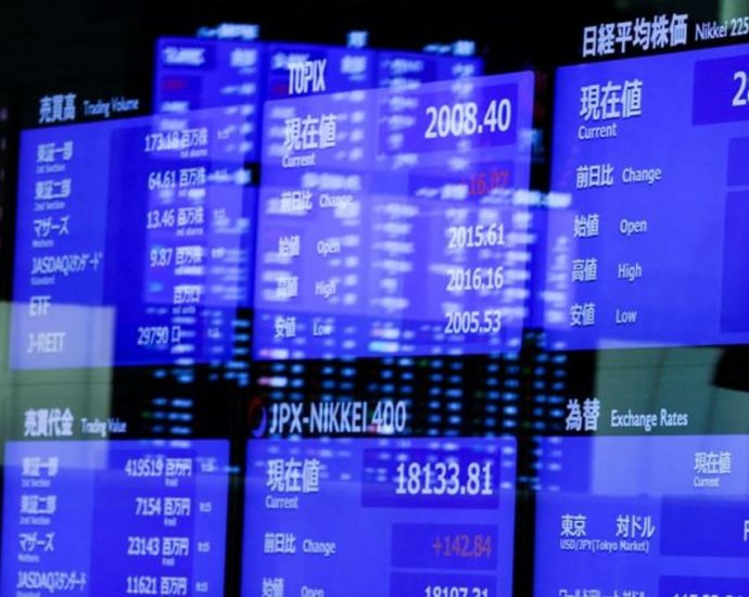 Asian stocks slide, safety shines as bank fears spread