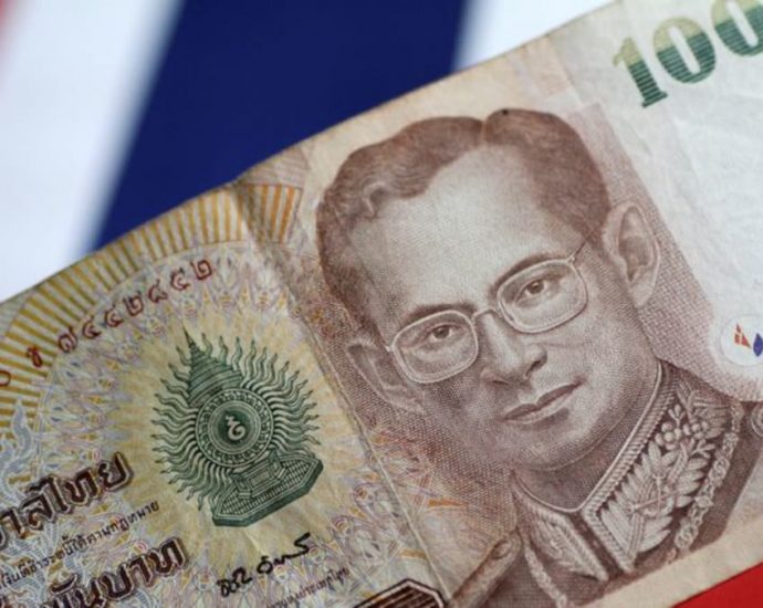 Commentary: Perils and promise beneath global enthusiasm for Thai baht