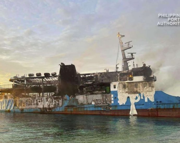 Death scene in burned Filipino ferry moves rescuers to tears