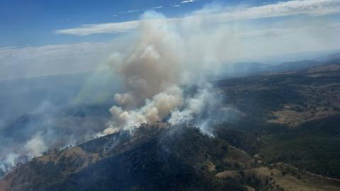 Dozens of bushfires spread as heat grips Australia’s east