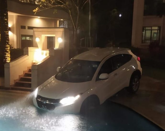 Management of Hillside condominium seeks damages after Gojek driver’s car ends up in swimming pool