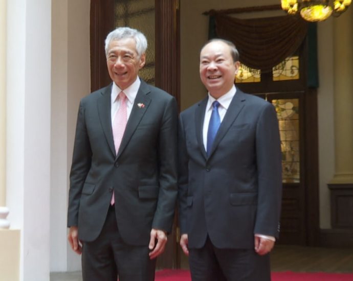 Singapore’s PM Lee meets Guangdong official Huang Kunming on third day of China visit