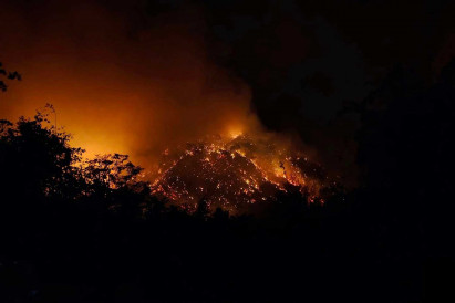 Spreading wildfire behind military academy