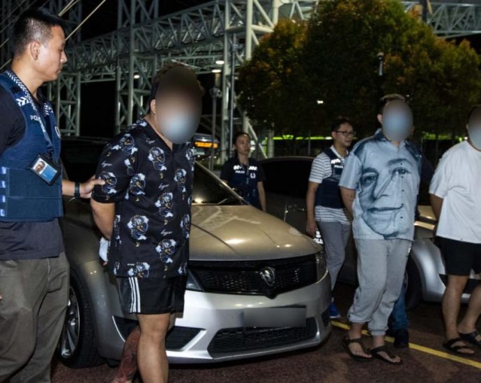 Three Malaysians extradited to Singapore over ‘fake friend’ scams