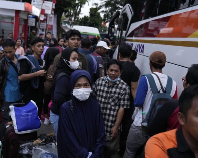 Millions of Indonesians expected to travel home for Eid, in one of the busiest mass exodus in years