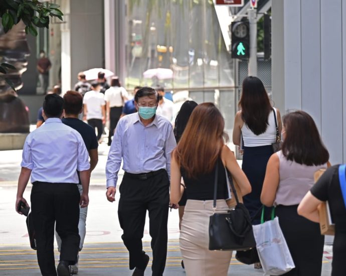 Some companies taking precautions amid Singapore’s COVID-19 wave, rise in employees on sick leave