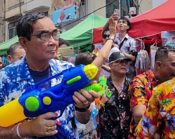 Thai PM Prayut gets a drenching in surprise water fight appearance