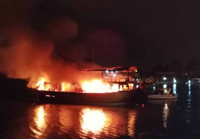 Boat catches fire at river pier